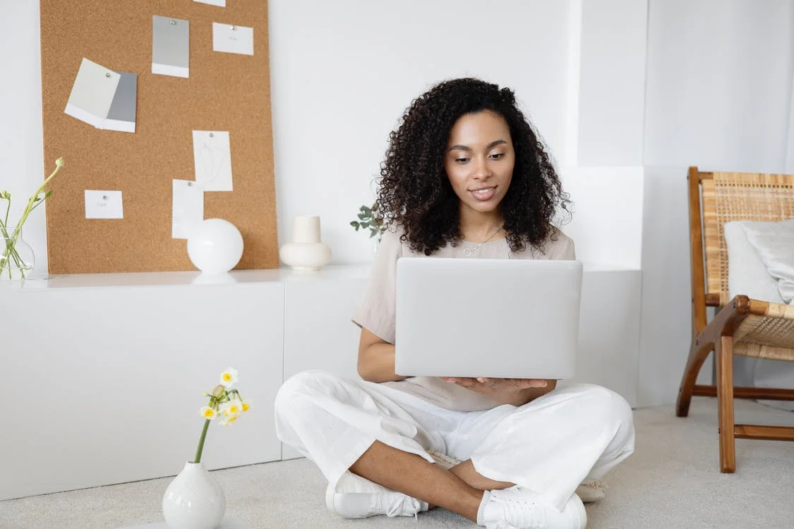 Lady using Laptop to explore the Web