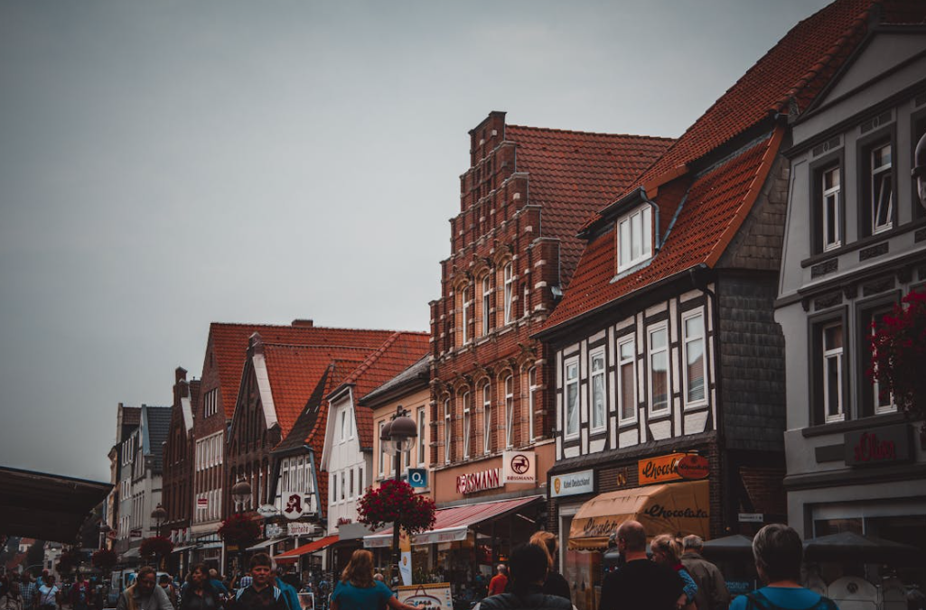 Busy high street full of retail shops and people